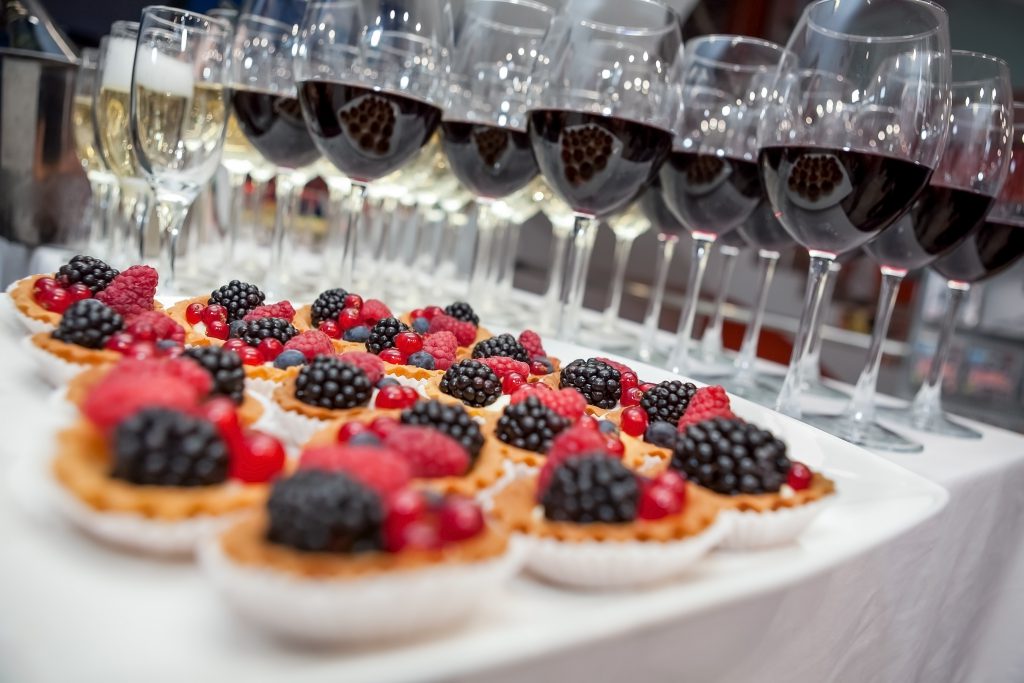 Festive buffet at the event with desert champagne and wine. Soft focus